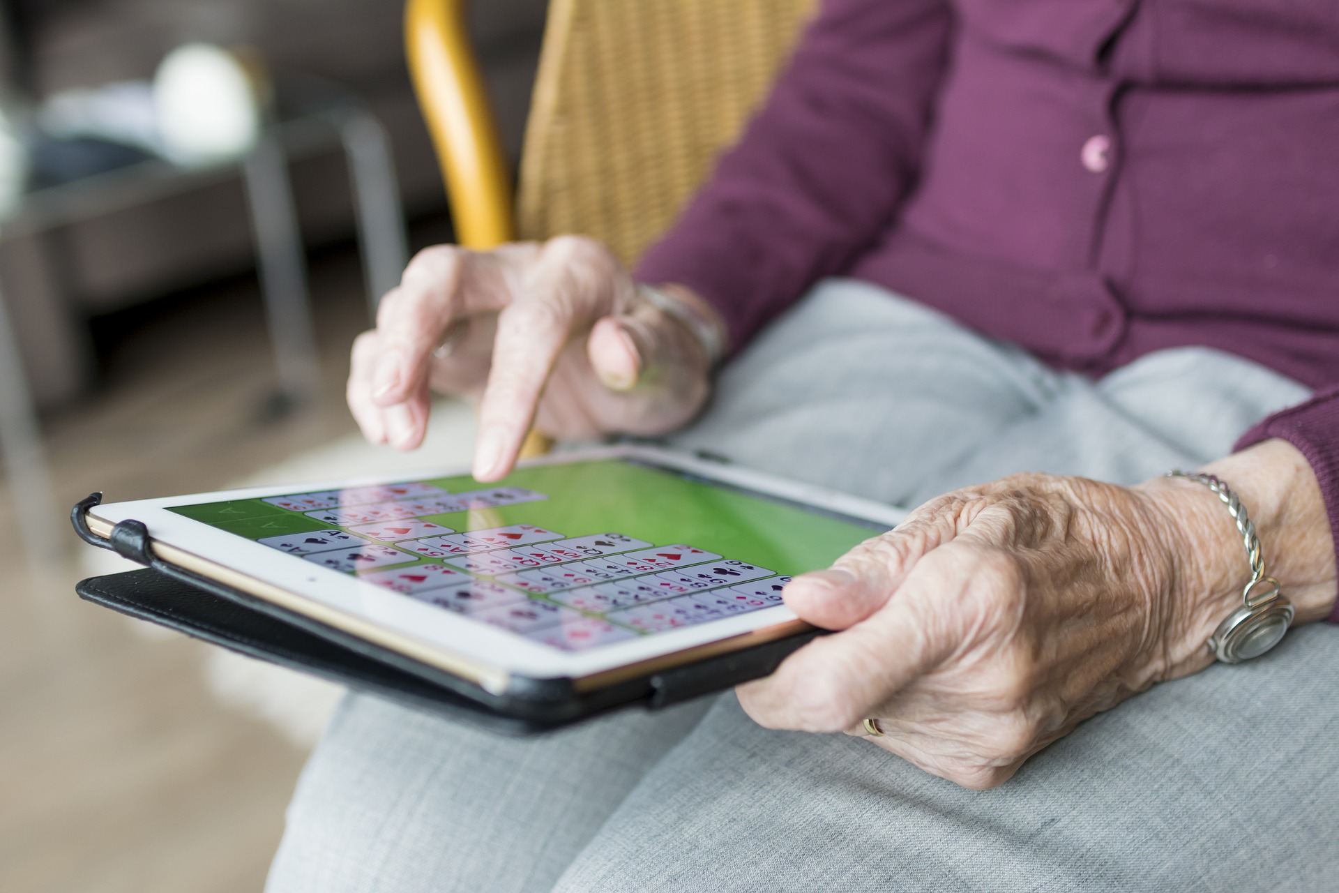older person using a tablet