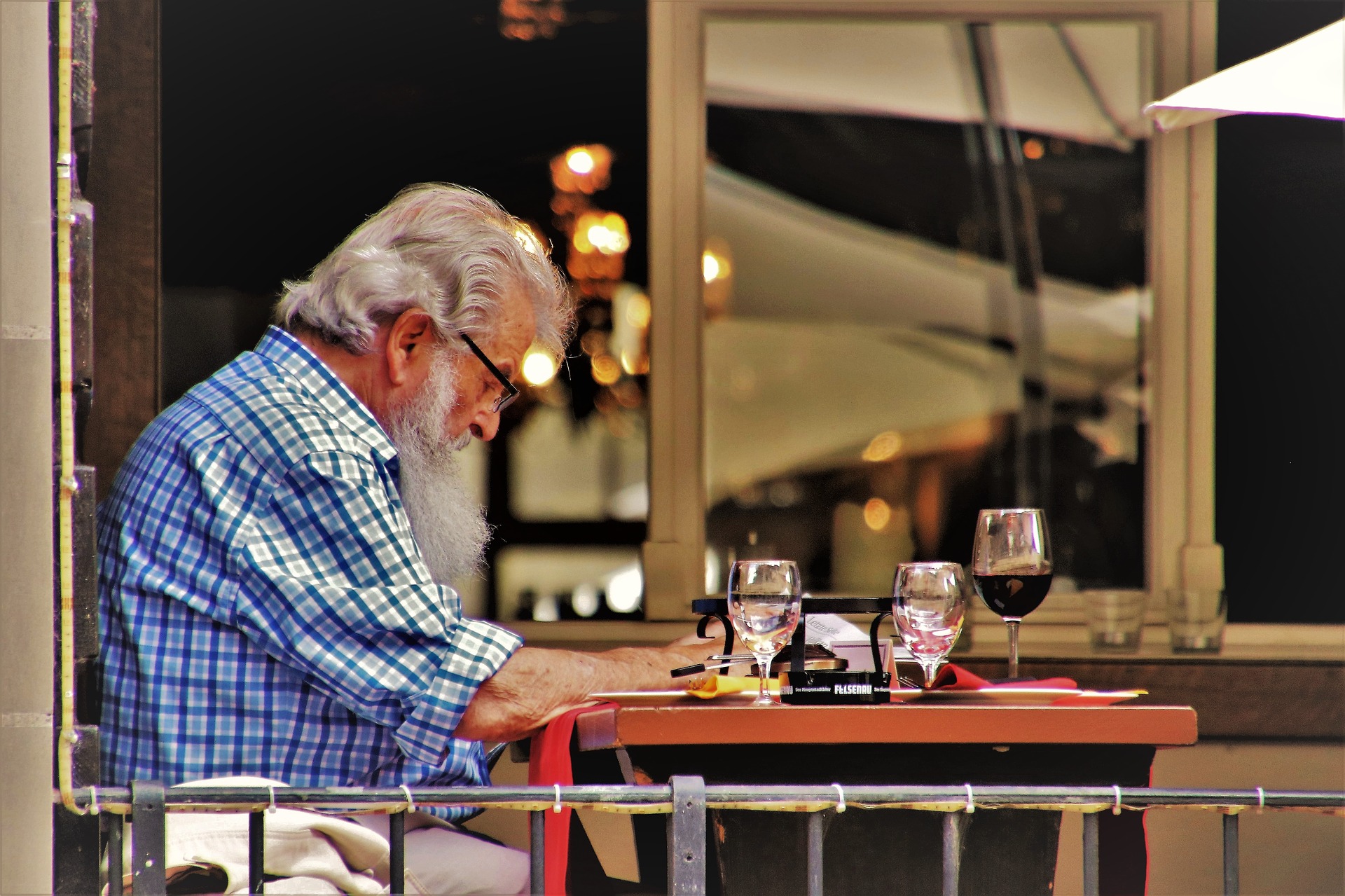 older man drinking wine