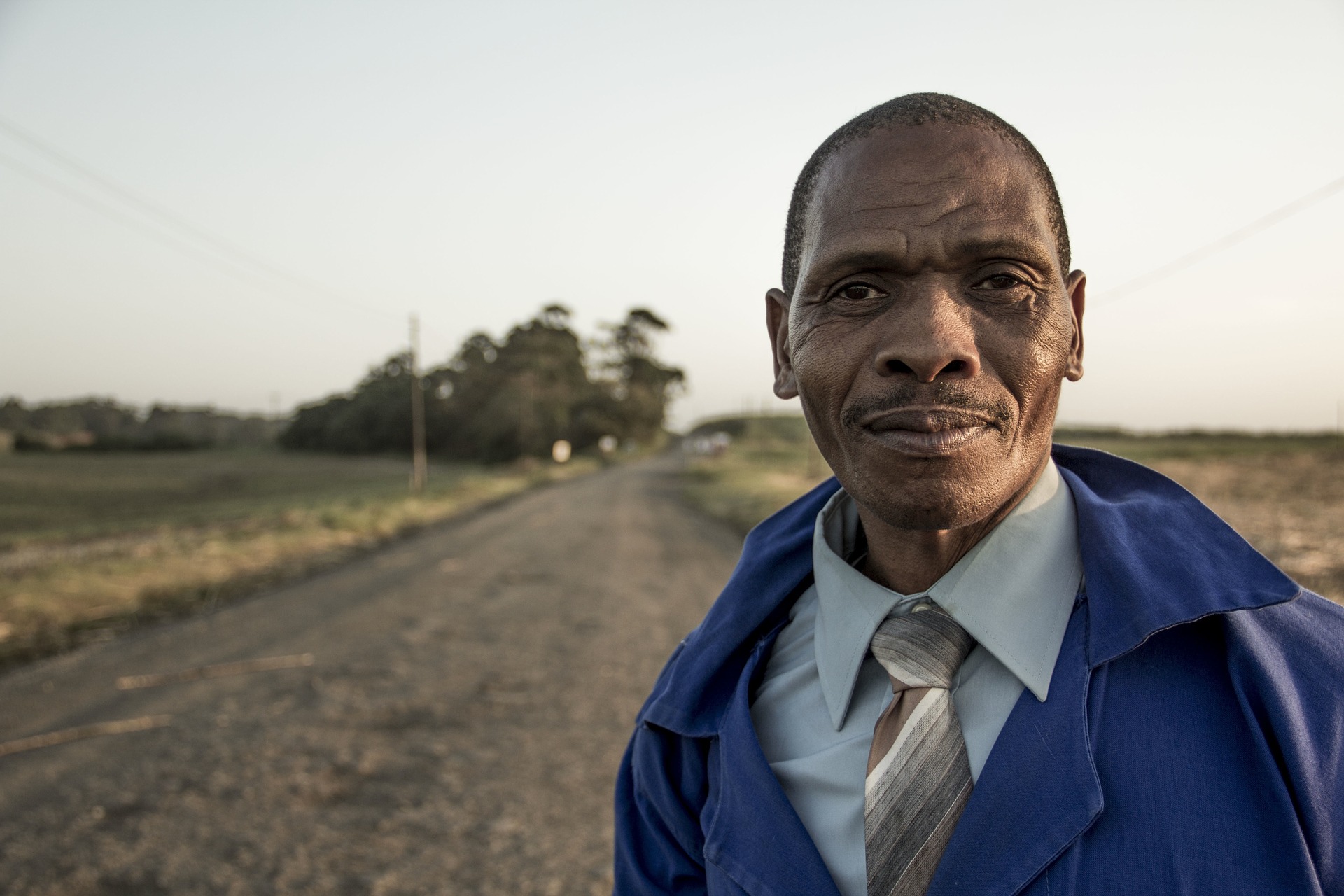 older man looking into camera