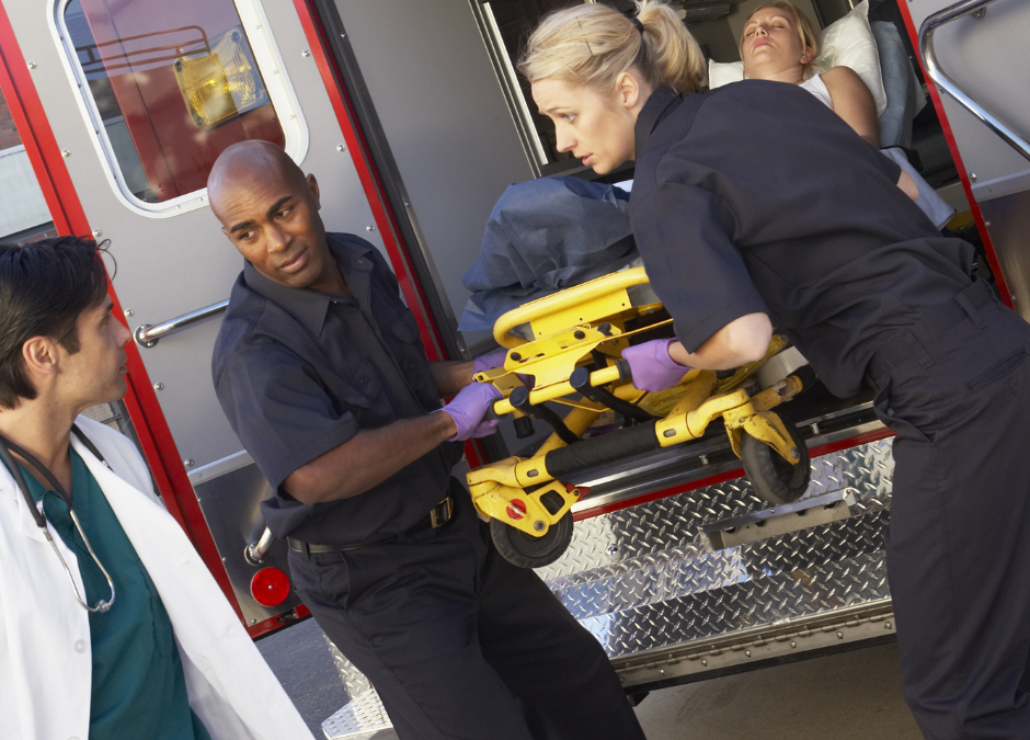 EMTs transport a patient in an ambulance during a medical emergency